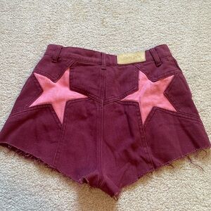 Nasty Gal maroon denim shorts with bubblegum pink stars on butt